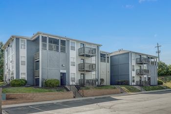 a picture of three apartment buildings with balconies